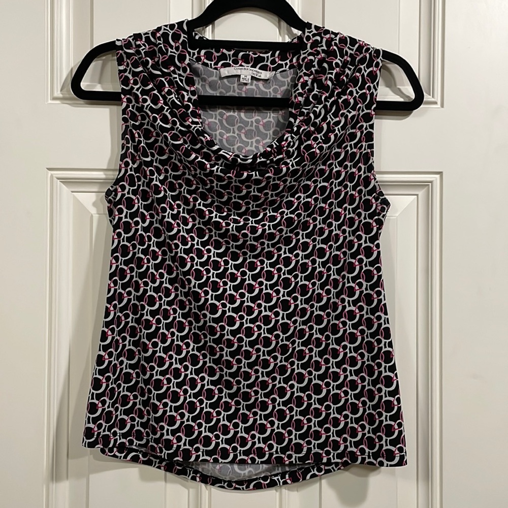 Career top, black with white and pink print. Size M medium sleeveless cowl neck.